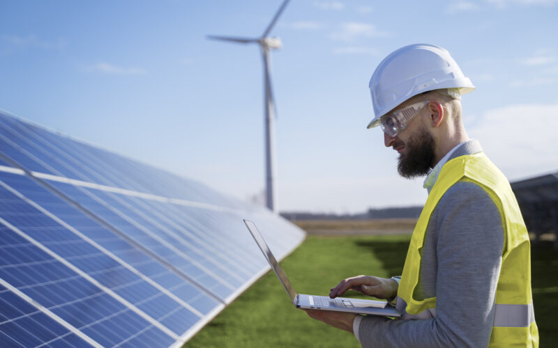 Medium shot environmental engineer holding laptop